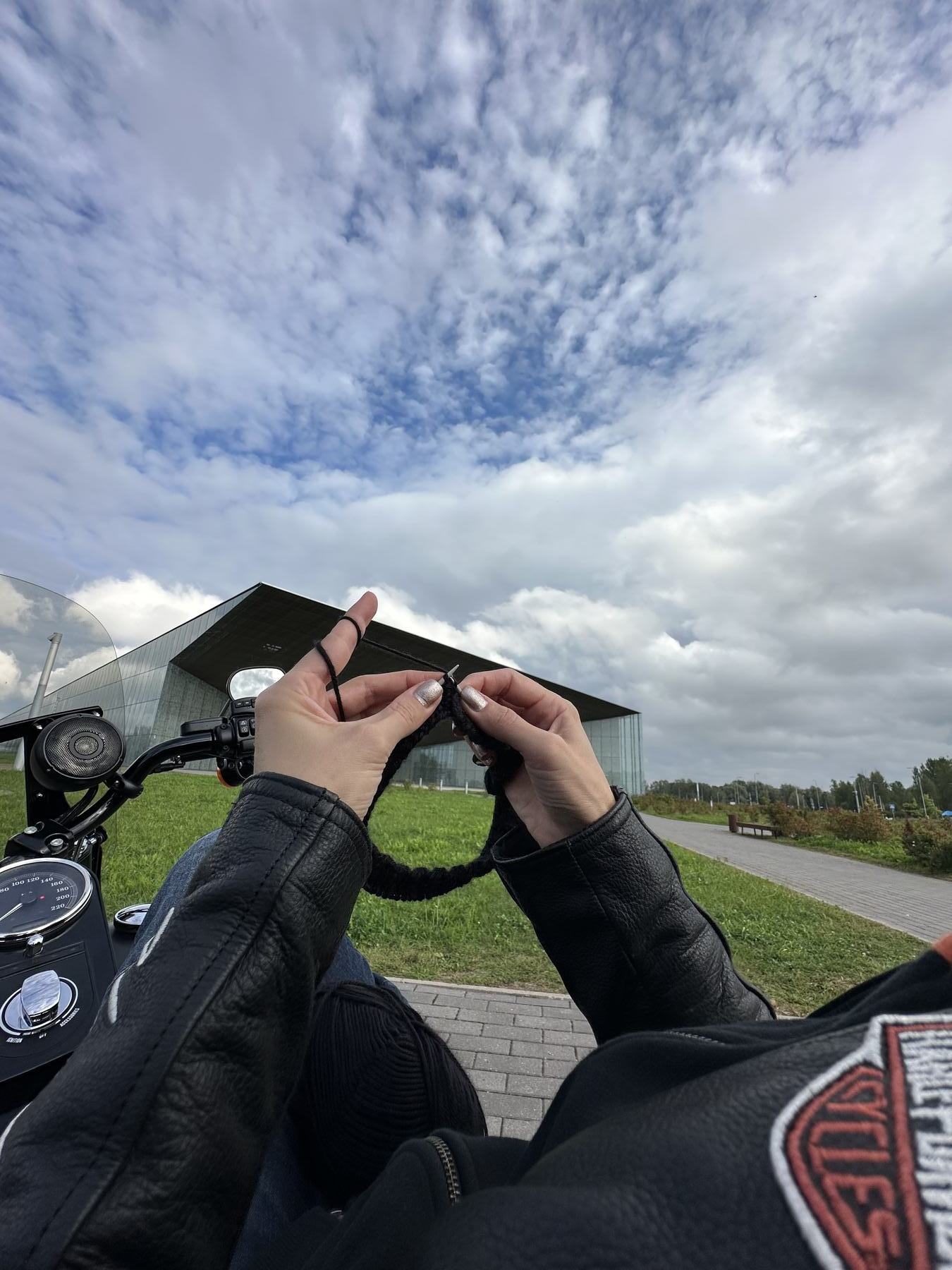 Knitting mid-ride on the back of a motorcycle
